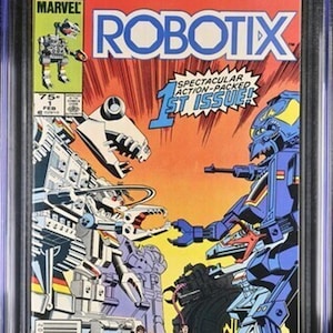 May include: A graded comic book titled "Robotix #1" from Marvel Comics, featuring a vibrant illustration of battling robots. The cover displays the Marvel logo, the issue number, and the text "Spectacular Action-Packed 1st Issue!"
