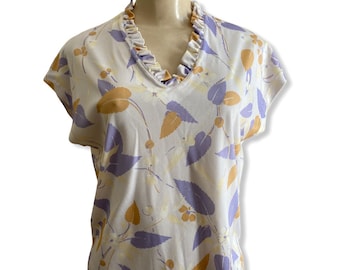 vintage short sleeve polyester shirt with cream and lilac floral pattern, sweet ruffle neck top, 70s shirt