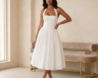 Elegante witte a-lijn midi-jurk met halternek - tijdloze vintage stijl