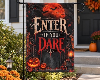 May include: A rectangular garden flag featuring a dark, spooky scene with a large red moon, silhouettes of bats, and two glowing jack-o'-lanterns. The text "ENTER IF YOU DARE" is printed in large, stylized, weathered white and red lettering.