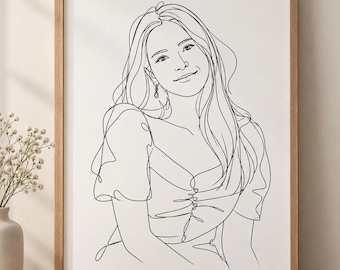 May include: A black and white line art portrait of a person with long hair, wearing a top with puff sleeves and a button-down front. The illustration is contained within a light-colored wooden frame, showcasing a continuous line drawing style.