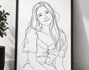 May include: A black and white line art portrait of a person with long hair, wearing a top with puffed sleeves and a buttoned front. The drawing is presented in a thin black frame, featuring a continuous line style that defines the facial features.