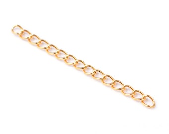 May include: A gold chain with a curb link style. The chain is about 10 inches long.