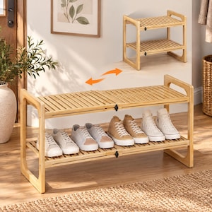 May include: A light-colored bamboo shoe rack with two tiers and a slatted design. The rack features an adjustable width mechanism with black hardware, shown in both a compact and an extended configuration, holding several pairs of sneakers.