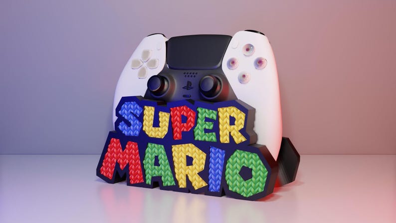 May include: A white ceramic mug with a black handle and the text "But First, Coffee" in a bold, black font. The mug is set against a blurred background, suggesting a cozy setting.