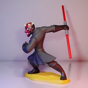 May include: A figurine of Darth Maul from Star Wars. The figure is in a dynamic pose, holding a red lightsaber. The character has a red and black face with horns, wearing a dark gray outfit and black boots. The figure stands on a yellow base.