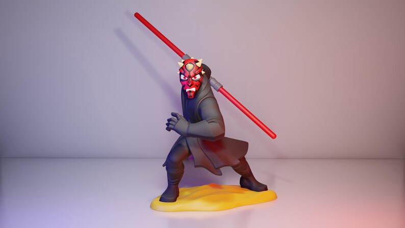 May include: A figurine of Darth Maul, a character from Star Wars, in a dynamic pose. The figure is predominantly black and gray, with a red face and horns. It holds a double-bladed red lightsaber. The figure stands on a yellow base.