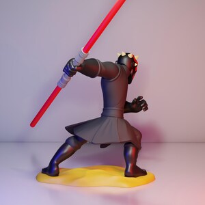 May include: A black and gray action figure of a character with a red lightsaber. The figure is in a dynamic pose, with a black outfit and a red and black helmet. It stands on a yellow base.