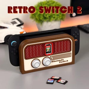 May include: A Nintendo Switch console docked in a brown and cream-coloured retro radio-style case. The case features a red speaker grill and white knobs. The text "Retro Switch 2" is displayed above. Several game cartridges are visible.