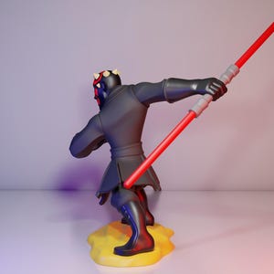May include: A black figure of a character with red and black facial markings, holding a red double-bladed lightsaber. The figure is posed on a yellow base, set against a gradient background of white, purple, and red.