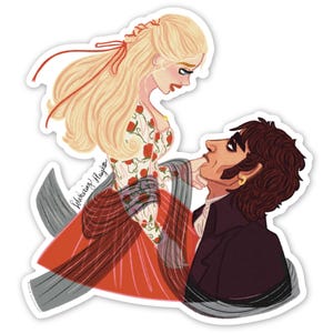 May include: A sticker featuring an illustration of a woman in a floral dress and a man in a dark coat. The woman has long blonde hair and the man has dark hair. The sticker has the text "Wuthering Heights".