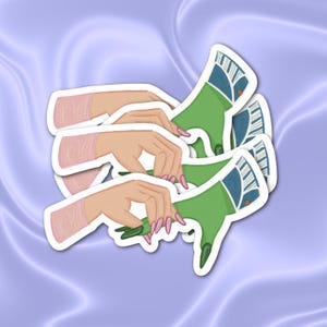May include: Three green and blue hand-drawn stickers with a design of a hand reaching out with long, sharp nails. The stickers are layered on top of each other.
