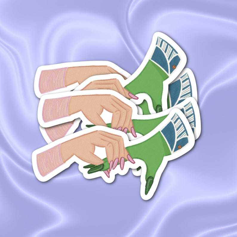 May include: Three green and blue hand-drawn stickers with a design of a hand reaching out with long, sharp nails. The stickers are layered on top of each other.