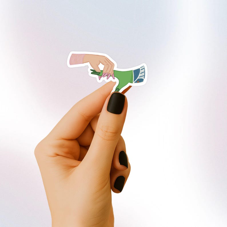 May include: A sticker featuring a green hand reaching out to a pink hand with long pink nails. The sticker is on a white background.