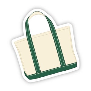 May include: Cream-colored tote bag with green accents. The bag features green handles and a green base. The design is simple and classic, suitable for carrying various items. The bag is made of a sturdy material.