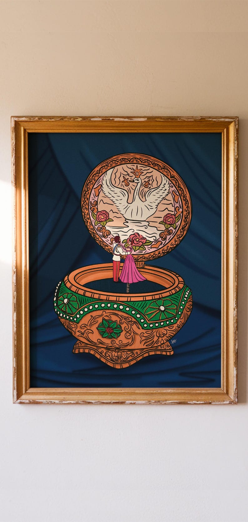 May include: A framed illustration of a music box with a swan and couple dancing. The box is orange and green with a detailed design. The background is a dark blue curtain.