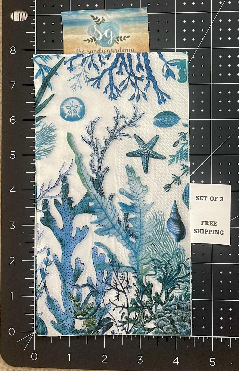 Paper Napkin featuring Blue coral and shells on white background