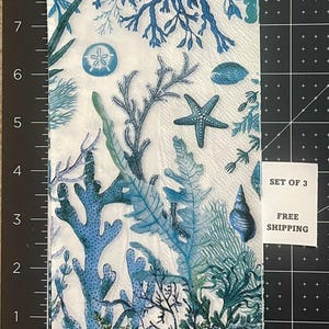 Paper Napkin featuring Blue coral and shells on white background