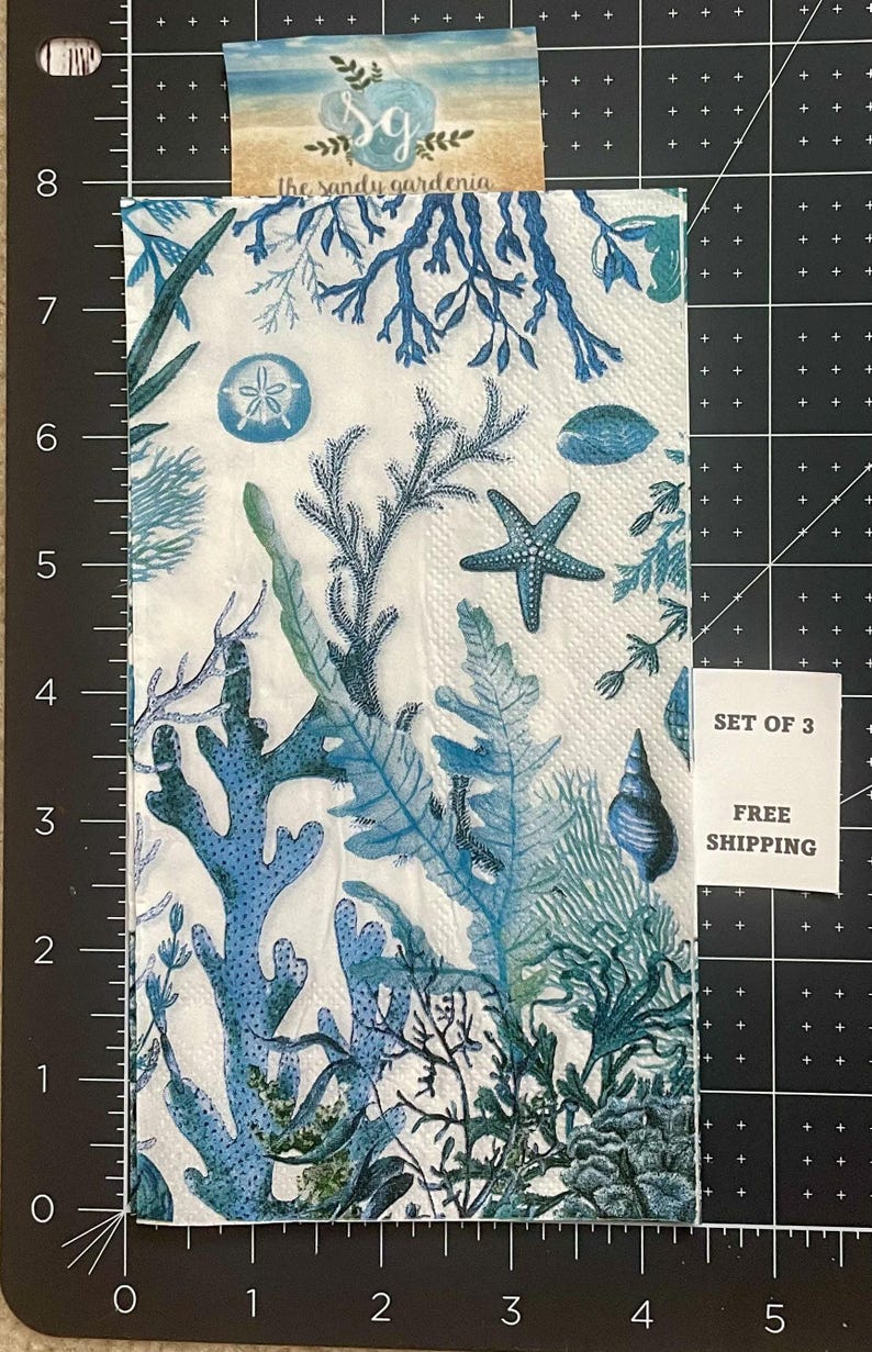 Paper Napkin featuring Blue coral and shells on white background