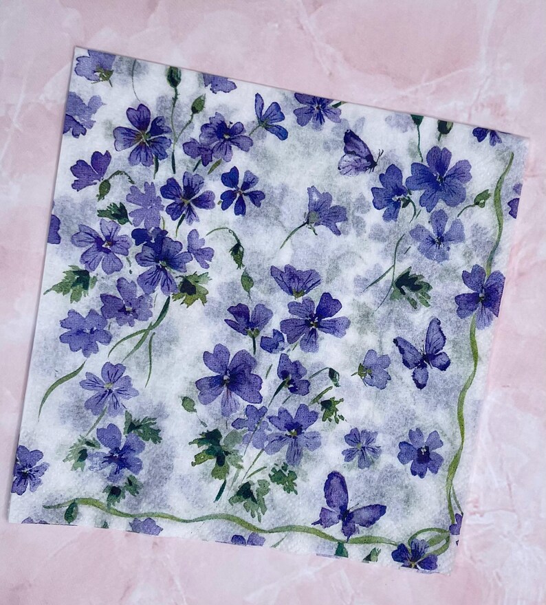 Paper Napkin featuring Cobalt blue vinca blooms with green stems on white background