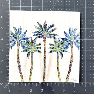 Paper Napkin featuring Blue and green mosaic patten palm leaves with multicolored palm tree trunk