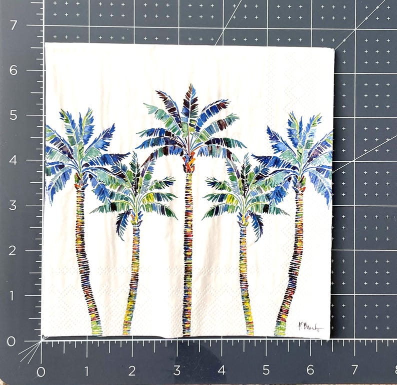 Paper Napkin featuring Blue and green mosaic patten palm leaves with multicolored palm tree trunk