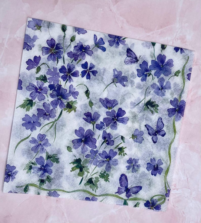 Paper Napkin featuring Cobalt blue vinca blooms with green stems on white background