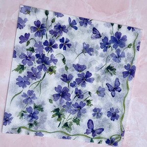 Paper Napkin featuring Cobalt blue vinca blooms with green stems on white background