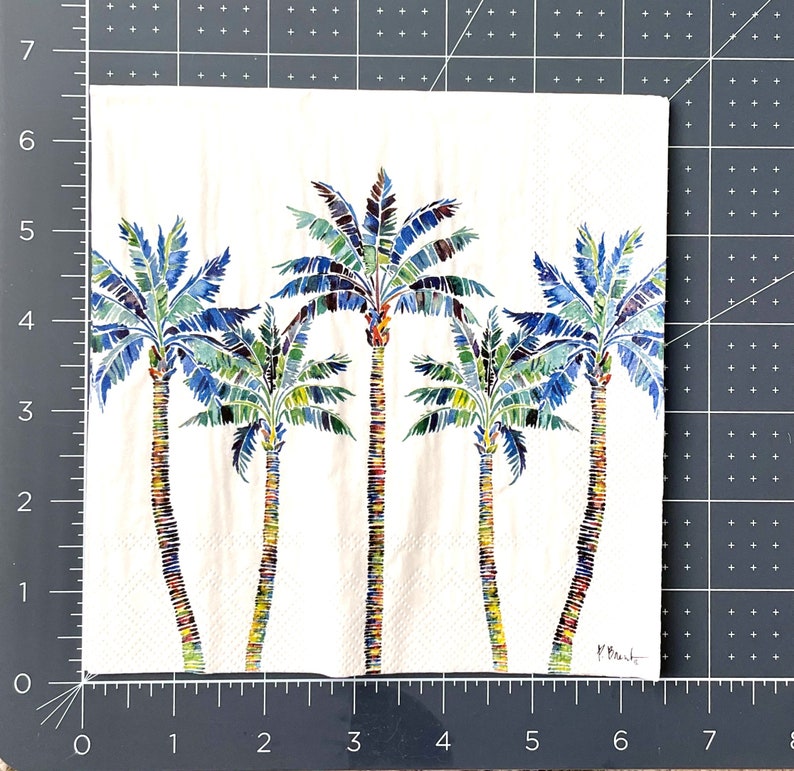 Paper Napkin featuring Blue and green mosaic patten palm leaves with multicolored palm tree trunk