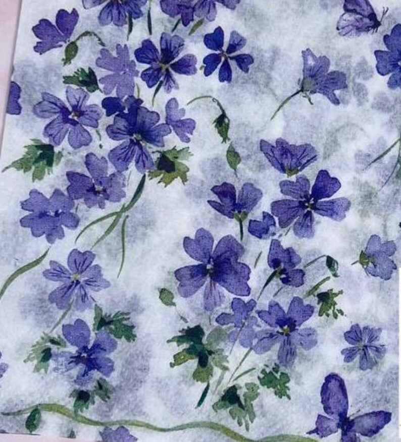 Paper Napkin featuring Cobalt blue vinca blooms with green stems on white background