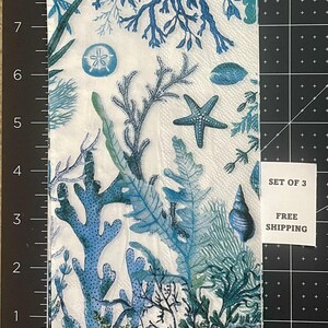 Paper Napkin featuring Blue coral and shells on white background