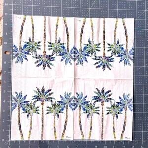 Paper Napkin featuring Blue and green mosaic patten palm leaves with multicolored palm tree trunk