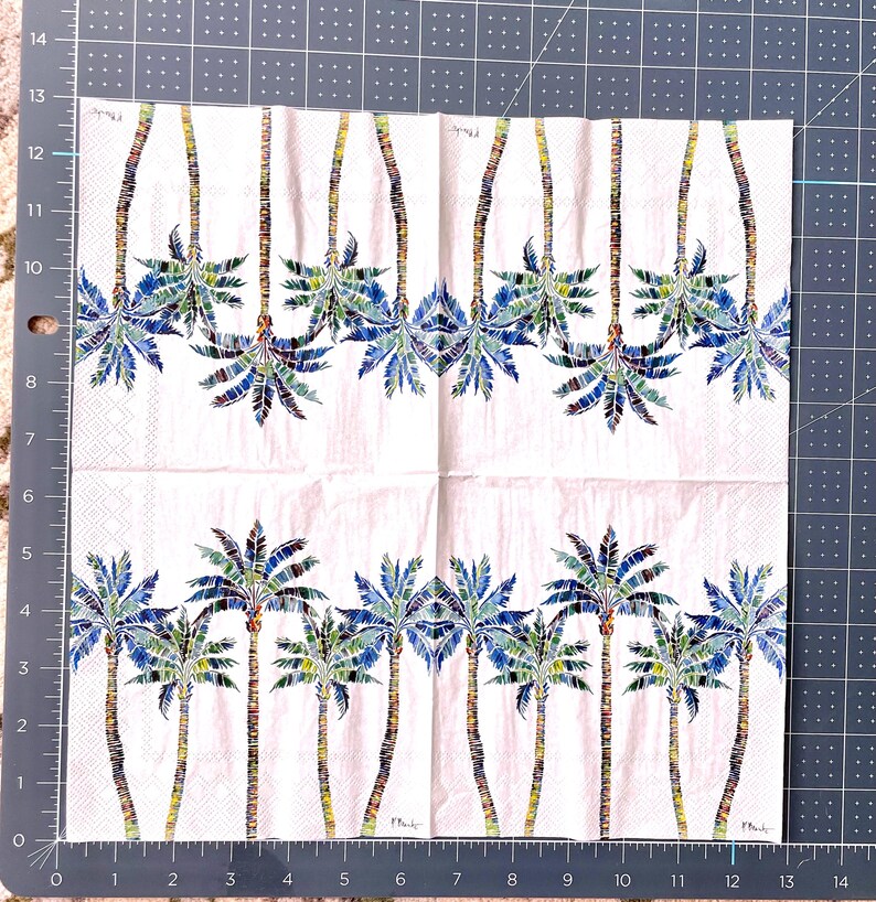 Paper Napkin featuring Blue and green mosaic patten palm leaves with multicolored palm tree trunk