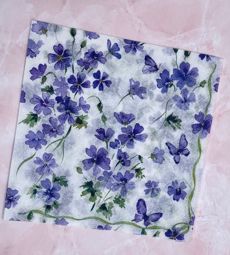 Paper Napkin featuring Cobalt blue vinca blooms with green stems on white background