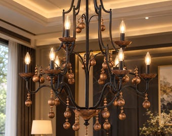 Pode incluir: Um lustre de metal preto com seis luzes tipo vela e arandelas castanhas texturizadas. A estrutura é adornada com numerosas contas esféricas suspensas com acabamento em bronze metálico, presas a braços curvos e a uma haste central.