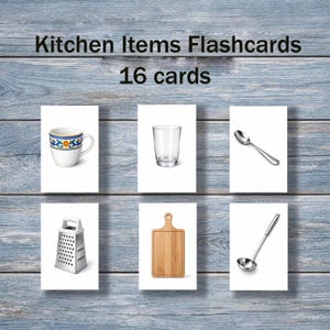 May include: Kitchen Items Flashcards with 16 cards. The flashcards feature illustrations of a mug, glass, spoon, grater, cutting board, and ladle. The mug has a white base with a blue, yellow, and orange floral design.