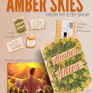 May include: A collection of items including a signed paperback book titled Amber Skies with a yellow floral cover, a double-sided bookmark, four mini stickers with text, and a double-sided 5x7 art print featuring a sunset scene with two figures.