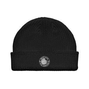 May include: Black knit beanie with a folded brim. A white circular patch on the front features the text "Death Star Tech Support" around a graphic of the Death Star.