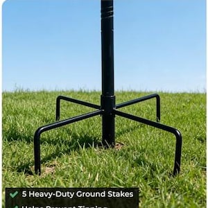 May include: A black metal garden stake featuring a central pole and five pronged ground supports. The text Stable Pronged Stake is at the top, and the text 5 Heavy-Duty Ground Stakes, Helps Prevent Tipping, and Built for Wind & Rain is at the bottom.