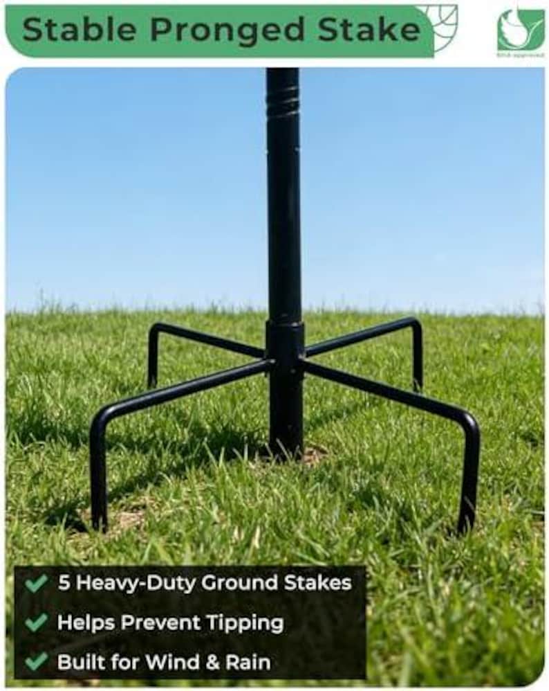 May include: A black metal garden stake featuring a central pole and five pronged ground supports. The text Stable Pronged Stake is at the top, and the text 5 Heavy-Duty Ground Stakes, Helps Prevent Tipping, and Built for Wind & Rain is at the bottom.