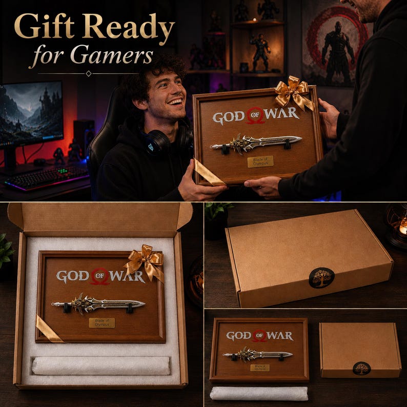 May include: A framed wooden plaque featuring the "God of War" logo and a replica of a sword. The plaque is presented in a gift box with a gold ribbon. The text "Gift Ready for Gamers" is at the top of the image.