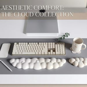 May include: A set of three ceramic mugs with a speckled, matte finish. Each mug features a different color: light blue, cream, and gray. The mugs have a simple, modern design and a comfortable handle.