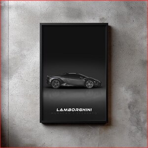 May include: A framed monochrome print showcasing a Lamborghini Huracan Sterrato. The grey sports car is depicted against a dark backdrop, with the Lamborghini logo and model name beneath. The print is enclosed within a black frame.