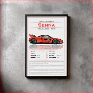 May include: Framed poster of a red McLaren Senna sports car. The poster displays the car's specifications, including engine, power, torque, and weight. The text "McLaren Senna" is at the top, with "Released | 2018" below. The car's top speed is 320 km/h.