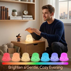 May include: A ghost-shaped silicone night light that emits a soft glow, featuring a color-changing function displayed in a spectrum from red to purple. The text at the bottom reads: Brighten a Gentle, Cozy Evening.