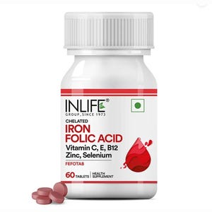 以下が含まれることがあります： リブ付きキャップが付いた白いプラスチックボトルには、Inlife Iron Folic Acidサプリメントの錠剤が60粒入っています。ラベルには赤い文字と赤い血液のしずくのグラフィックがあり、ビタミンC、E、B12、亜鉛、セレンが記載されています。ボトルの前には、赤茶色の丸い錠剤がいくつか置かれています。