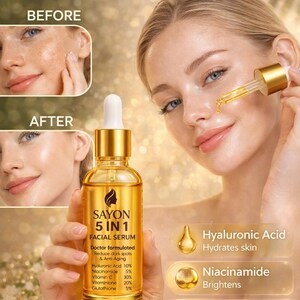 May include: A woman applying facial serum from a gold-colored bottle. The bottle is labeled "SAYON 5 IN 1 FACIAL SERUM" and includes ingredients like Hyaluronic Acid and Vitamin C. Text reads "This Makes Skin Glow" and "Shop now".