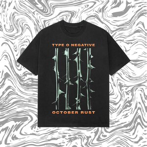 May include: Black t-shirt featuring the band name "TYPE O NEGATIVE" and "OCTOBER RUST" in orange text. The shirt design includes vertical thorn illustrations in a light green color.
