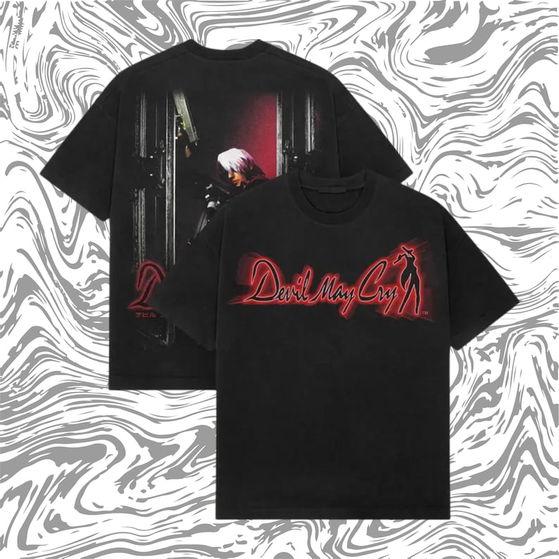 May include: Black t-shirts featuring the "Devil May Cry" logo in red and a silhouette of a character. The back of one shirt displays a character with a gun. The shirts have a vintage, worn look.