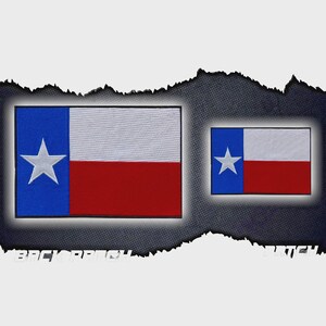 May include: Two embroidered patches depicting the Texas state flag. The larger patch is rectangular, with a blue vertical stripe containing a white star, a white horizontal stripe, and a red horizontal stripe. The smaller patch has the same design.